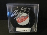 Dominic Hasek Autographed Puck (Detroit Red Wings)